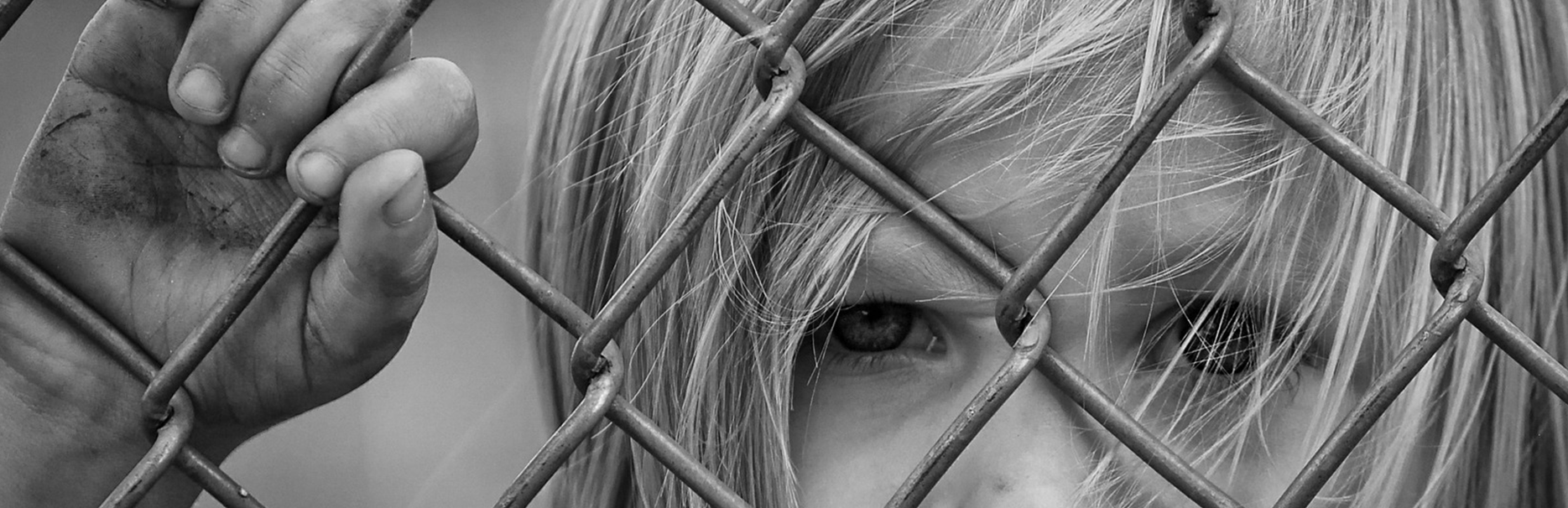 child behind fence